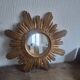 Vintage sun mirror in gilded wood. 1960