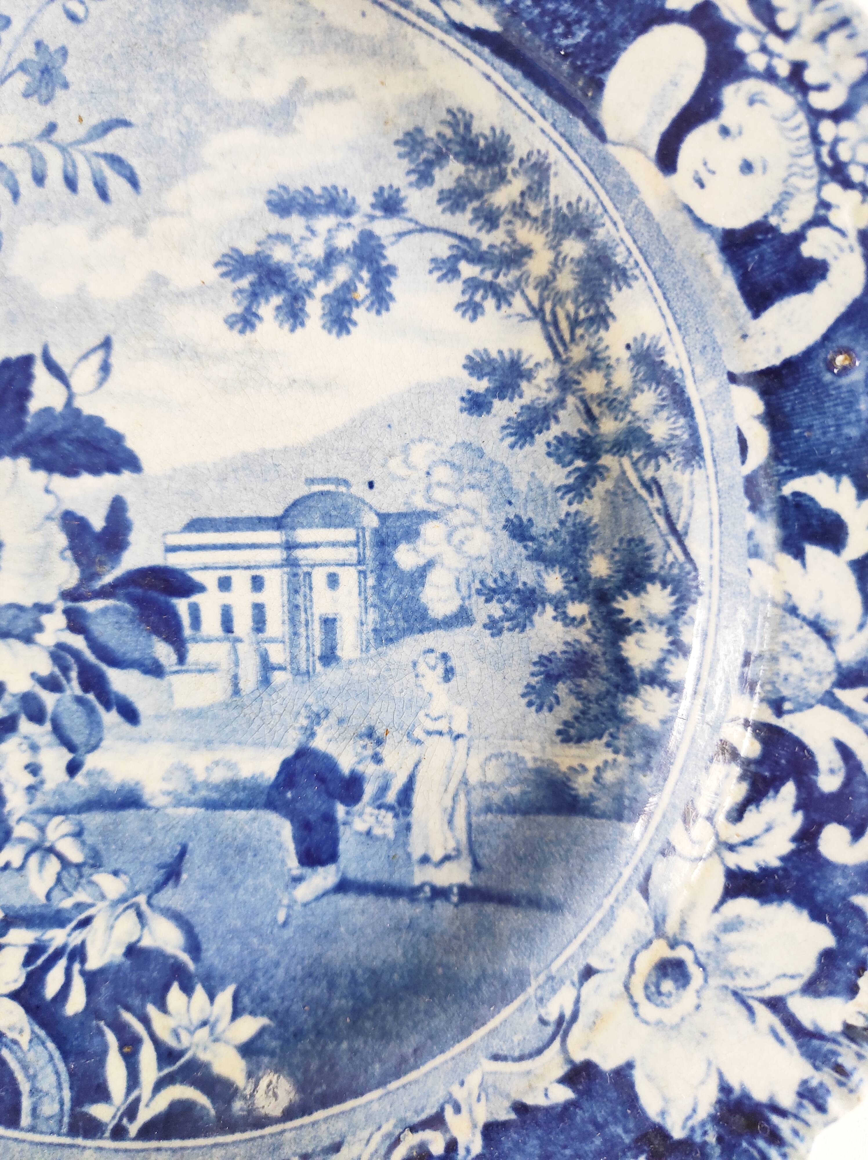 Five 19th century Calais earthenware plates with a romantic gallant couple decor