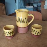 Ceramic carafe and two matching ceramic cups