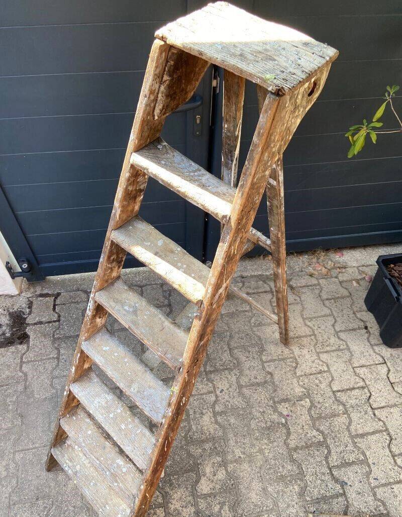 Antique authentic painter's stepladder in vintage patinated wood
