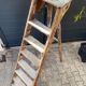 Antique authentic painter's stepladder in vintage patinated wood
