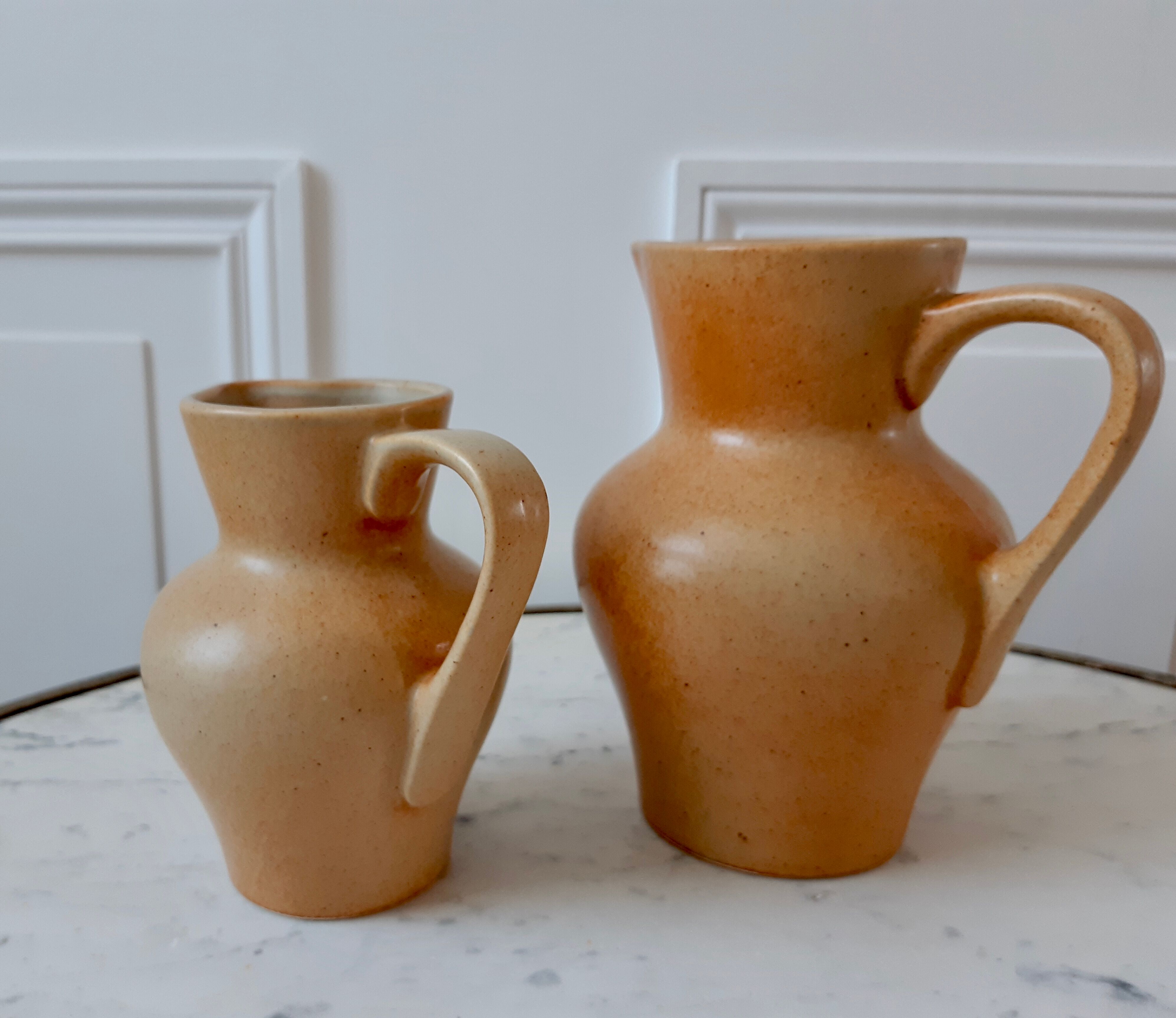 Duo of vintage sandstone pitchers Made In France