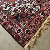 Persian carpet in wool and silk, old rose.