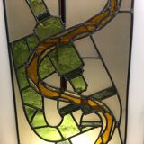 Old stained glass sign with deciduous decoration and microscope