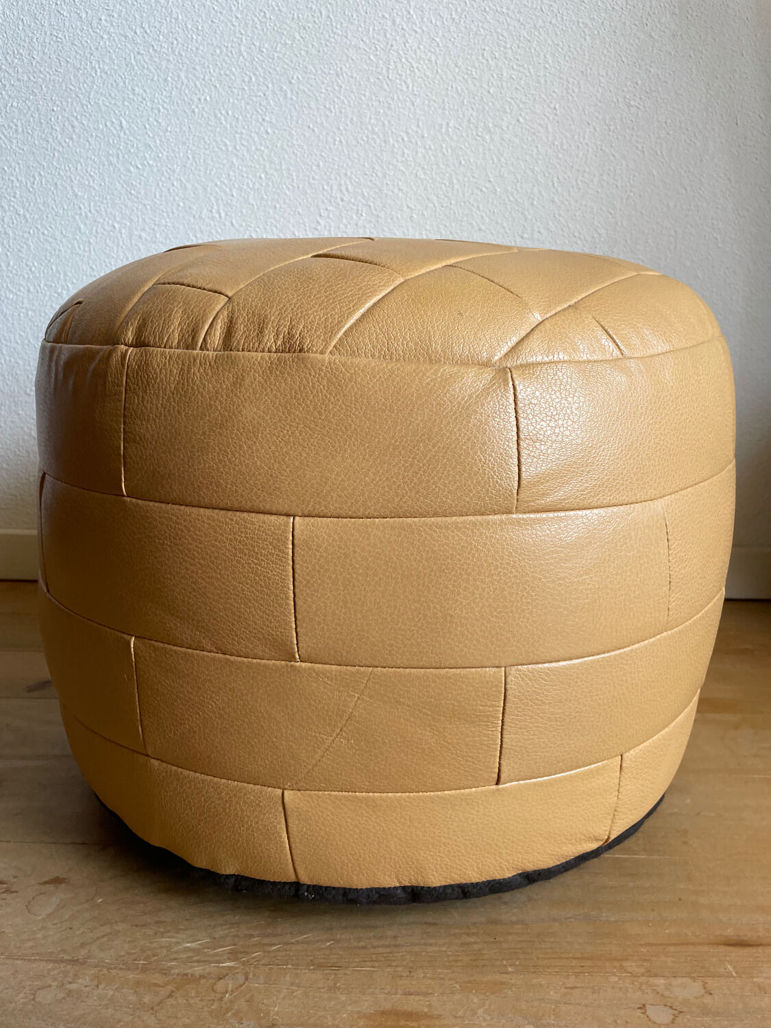 Beige patchwork leather pouf from Sède