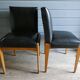 Paire de fauteuils à système en skaï noir, années 50