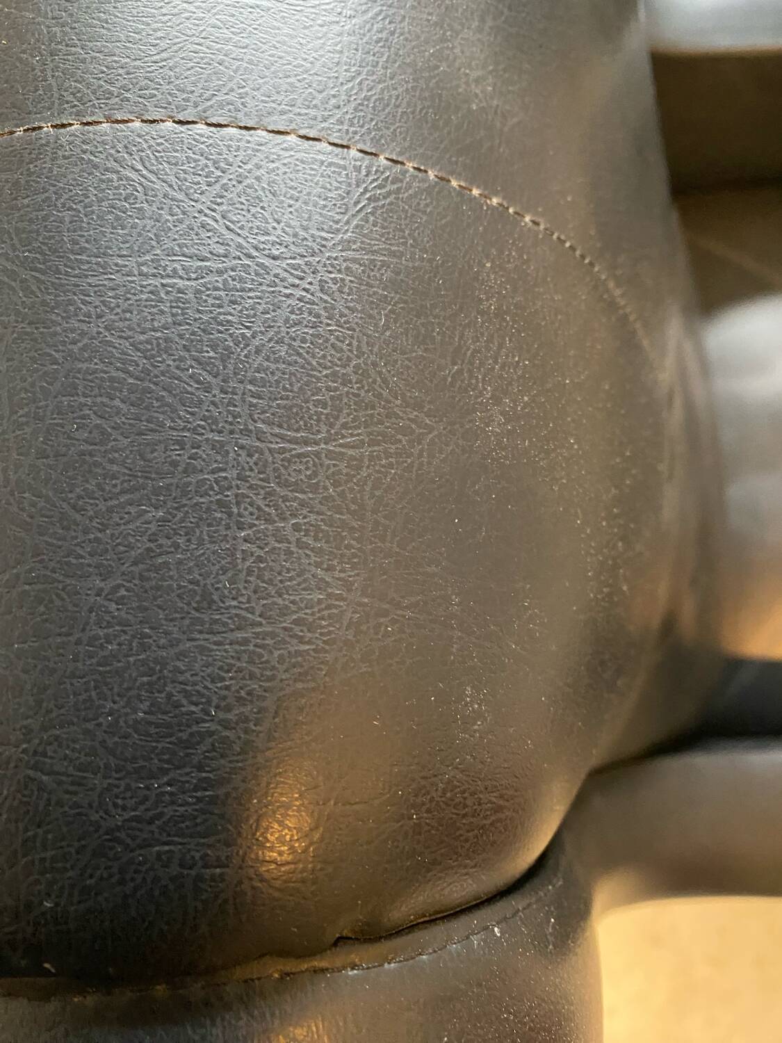 2 vintage faux leather armchairs