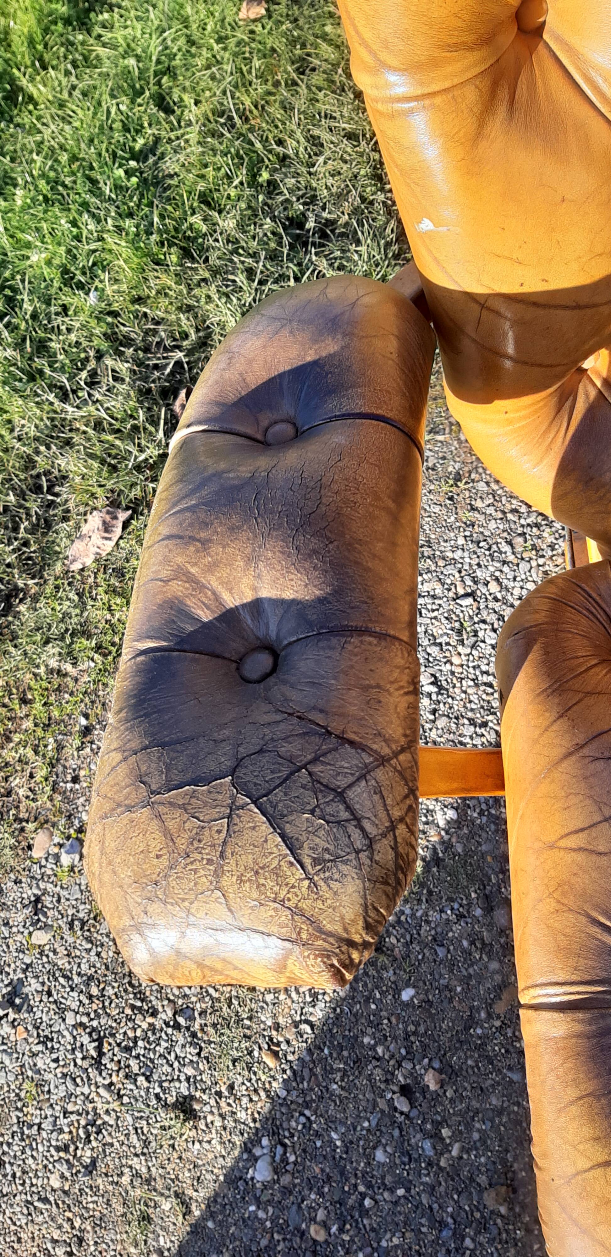 Pair of chesterfield style leather armchairs