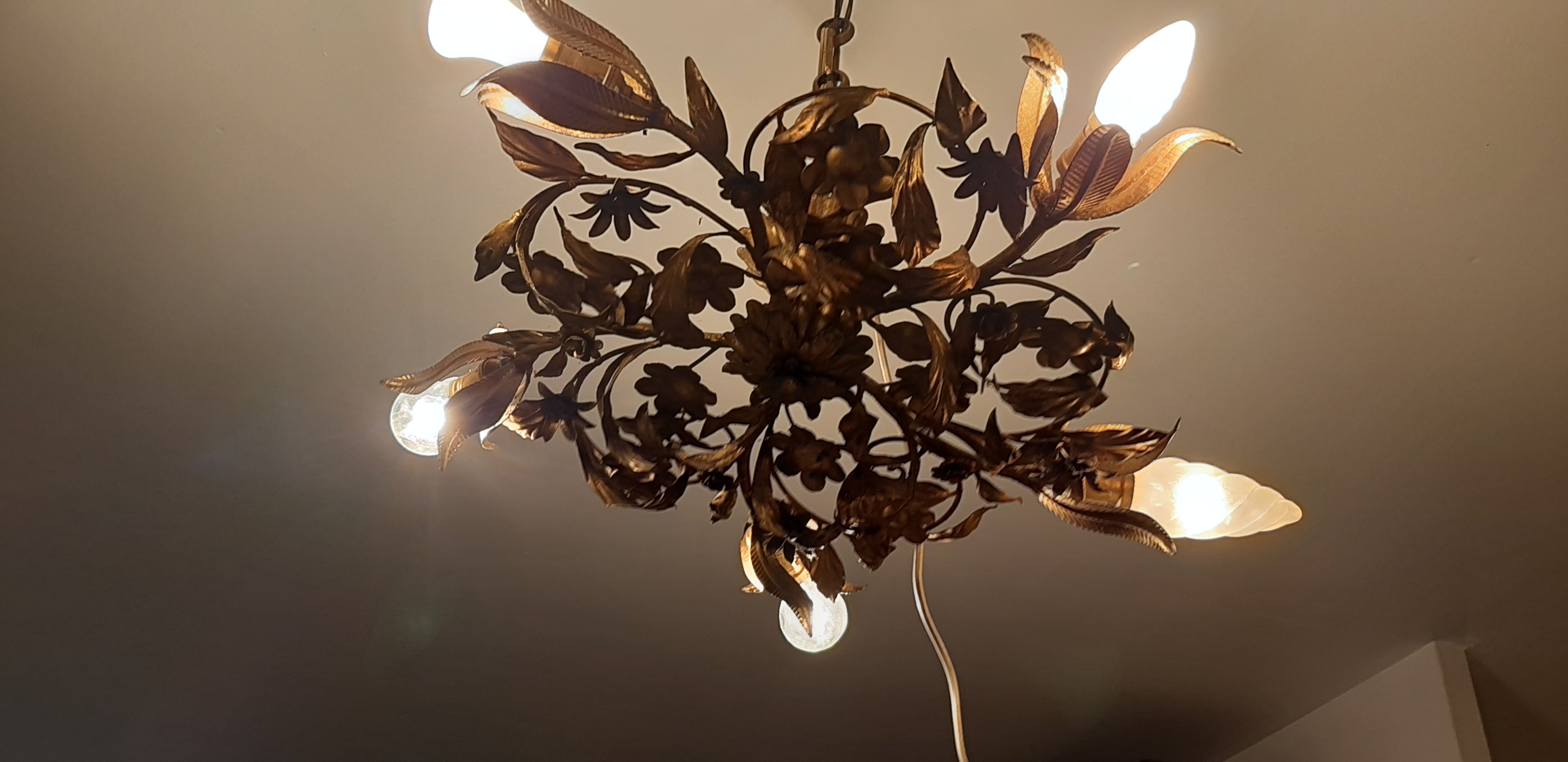 Vintage chandelier in gilded metal