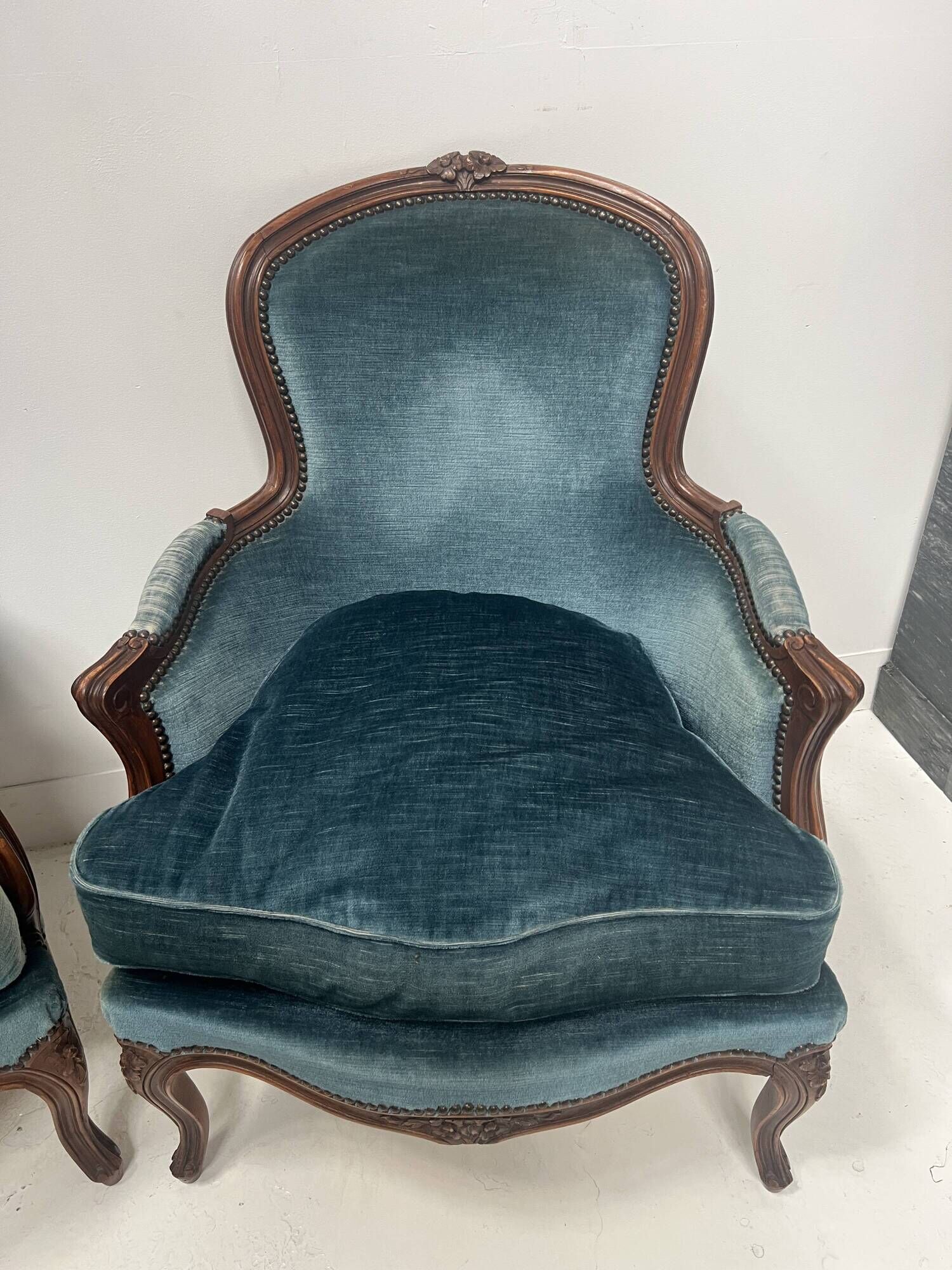 Pair of Louis XV style armchairs in natural wood, 20th century.