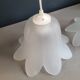 Pair of frosted glass flower pendant lights