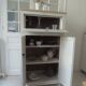 Small vintage piece of furniture sublimated in a linen shade, wooden top.
