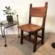 Spanish chair in leather and carved wood, 1950s/60s.