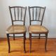 4 mismatched antique bistro chairs in wood and caning