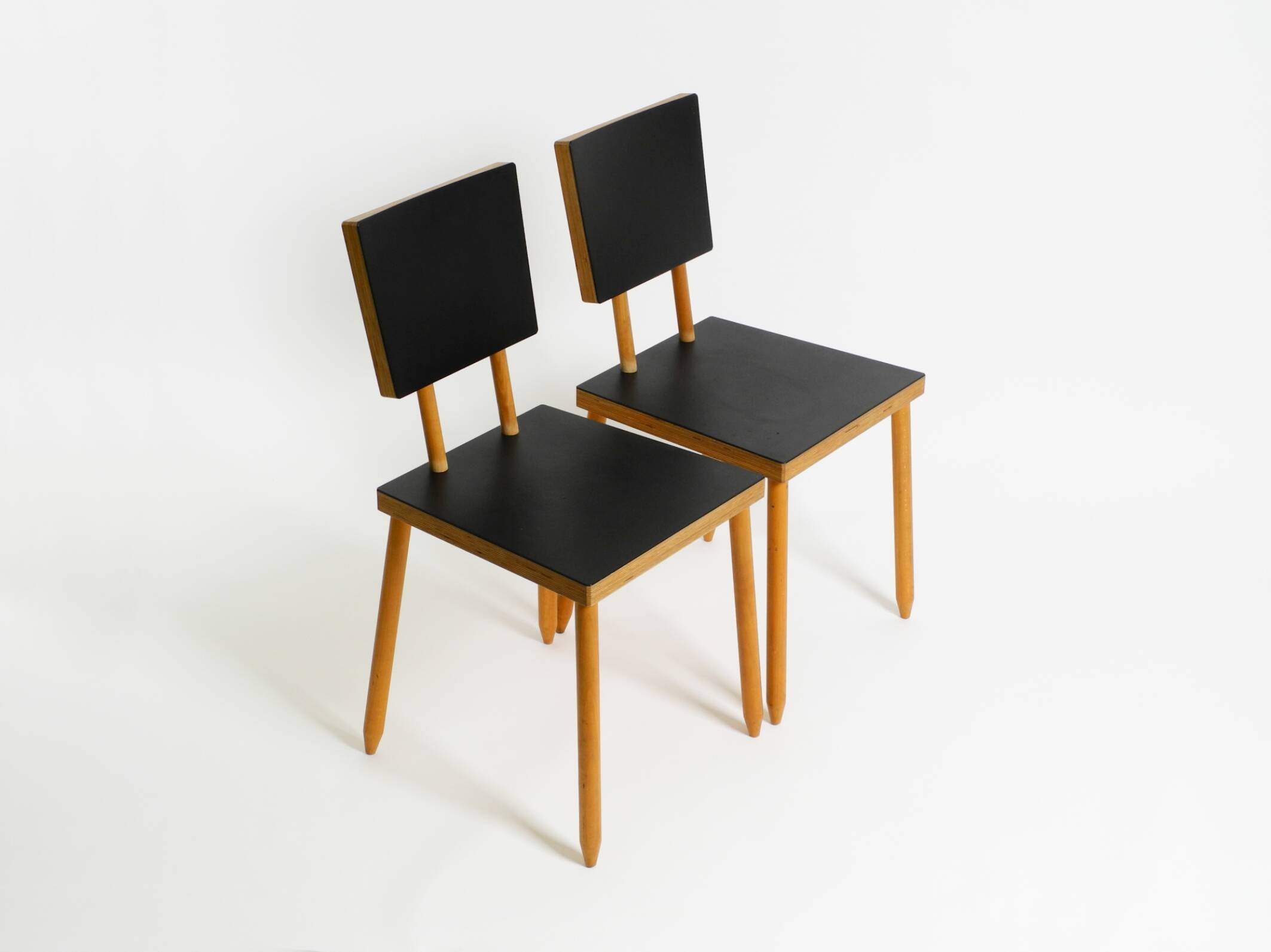 Two rare demountable plywood chairs by Axel Kufus model Stöcke for Atoll