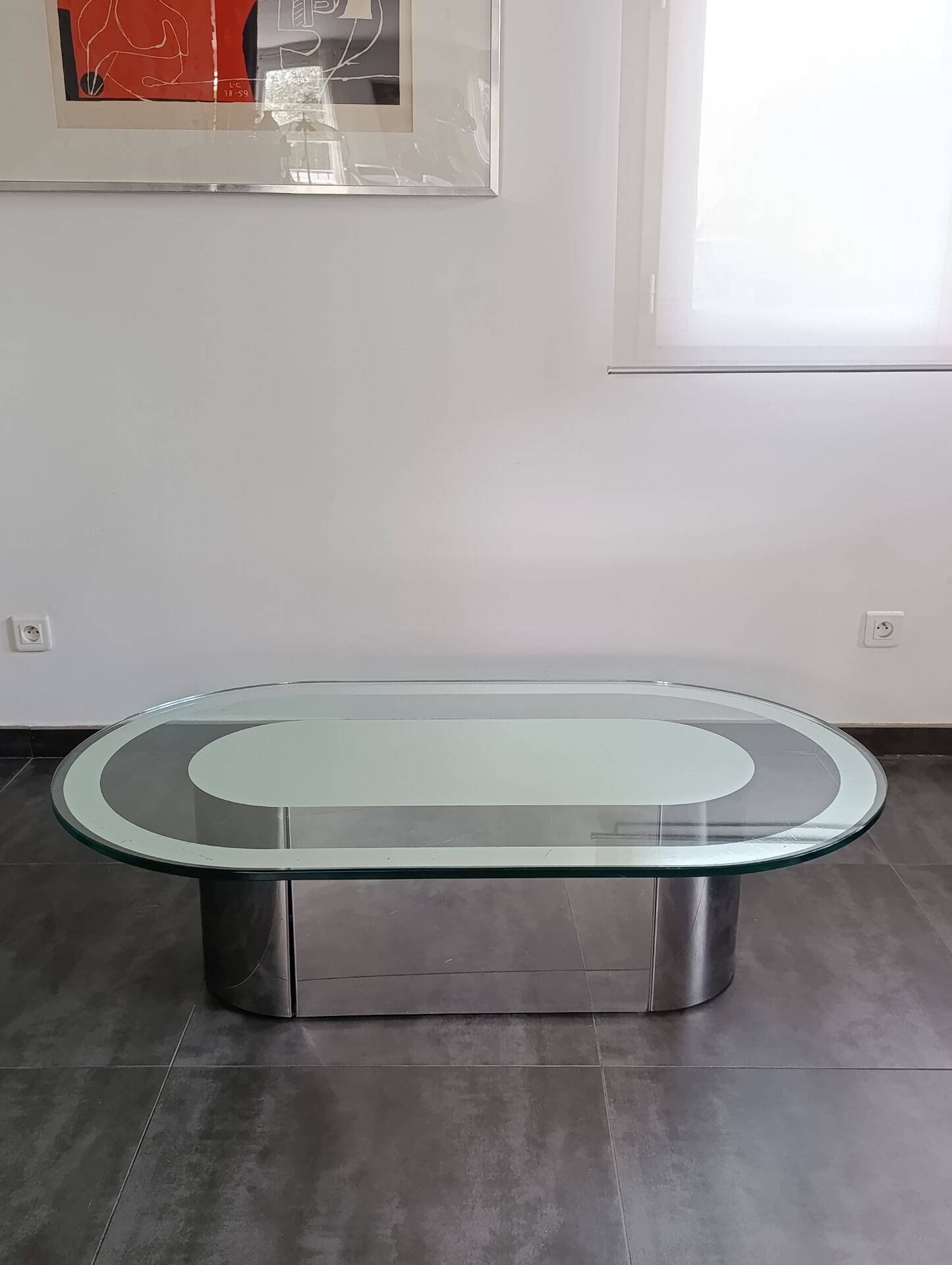 Vintage coffee table with glass and chrome metal.