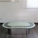 Vintage coffee table with glass and chrome metal.