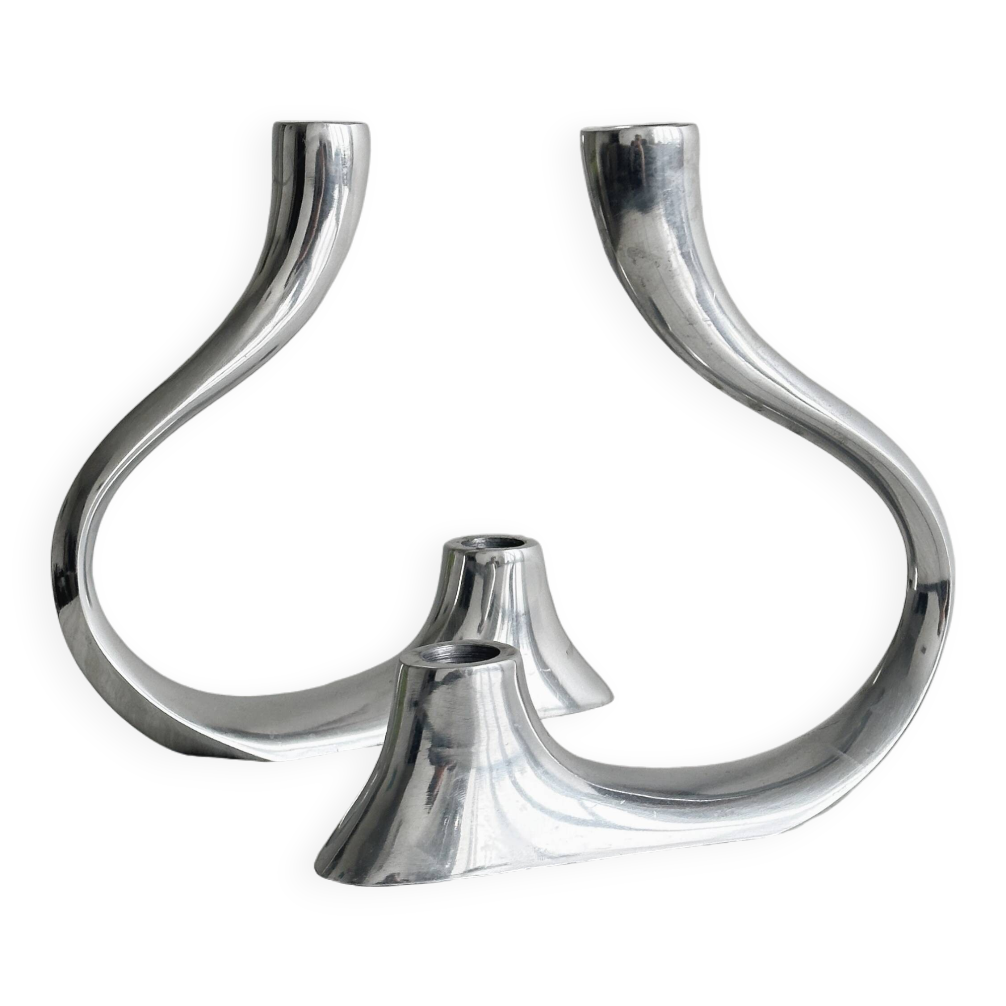 Pair of designer candlesticks in chromed metal