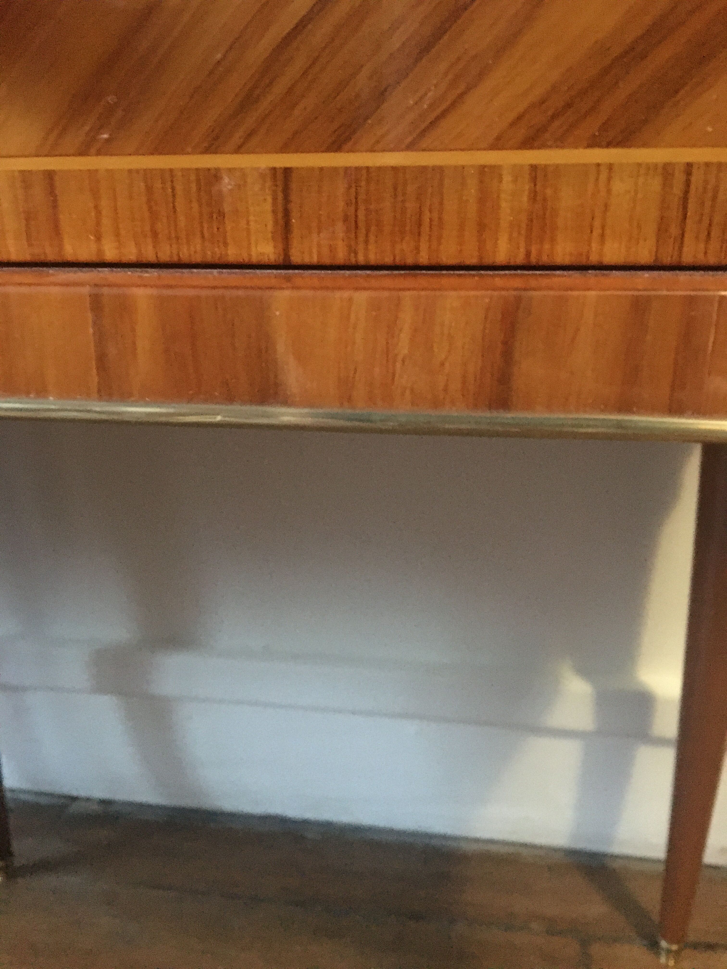 Pair of rosewood and brass bedsides circa 1950