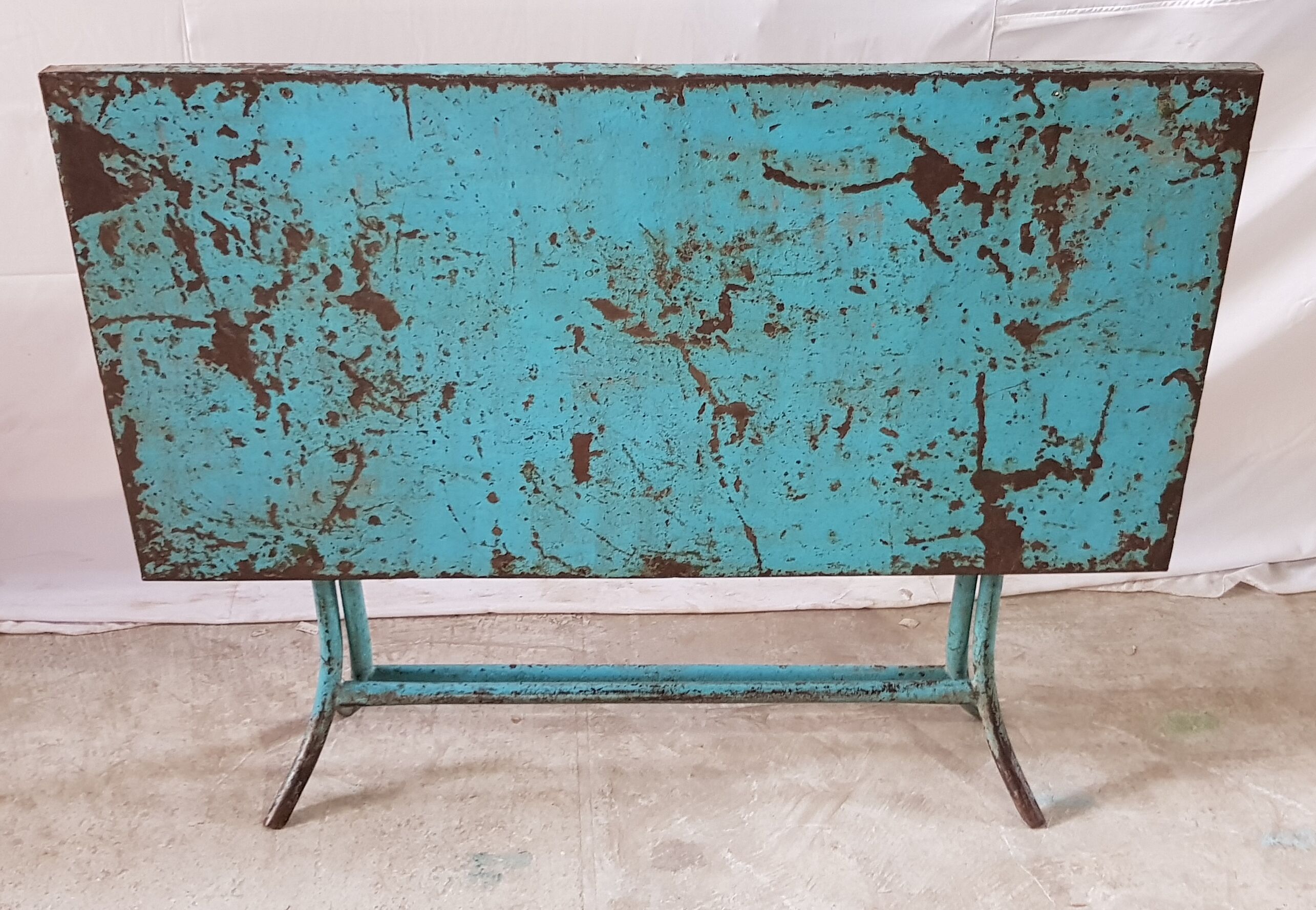 Old metal folding table with its original turquoise patina