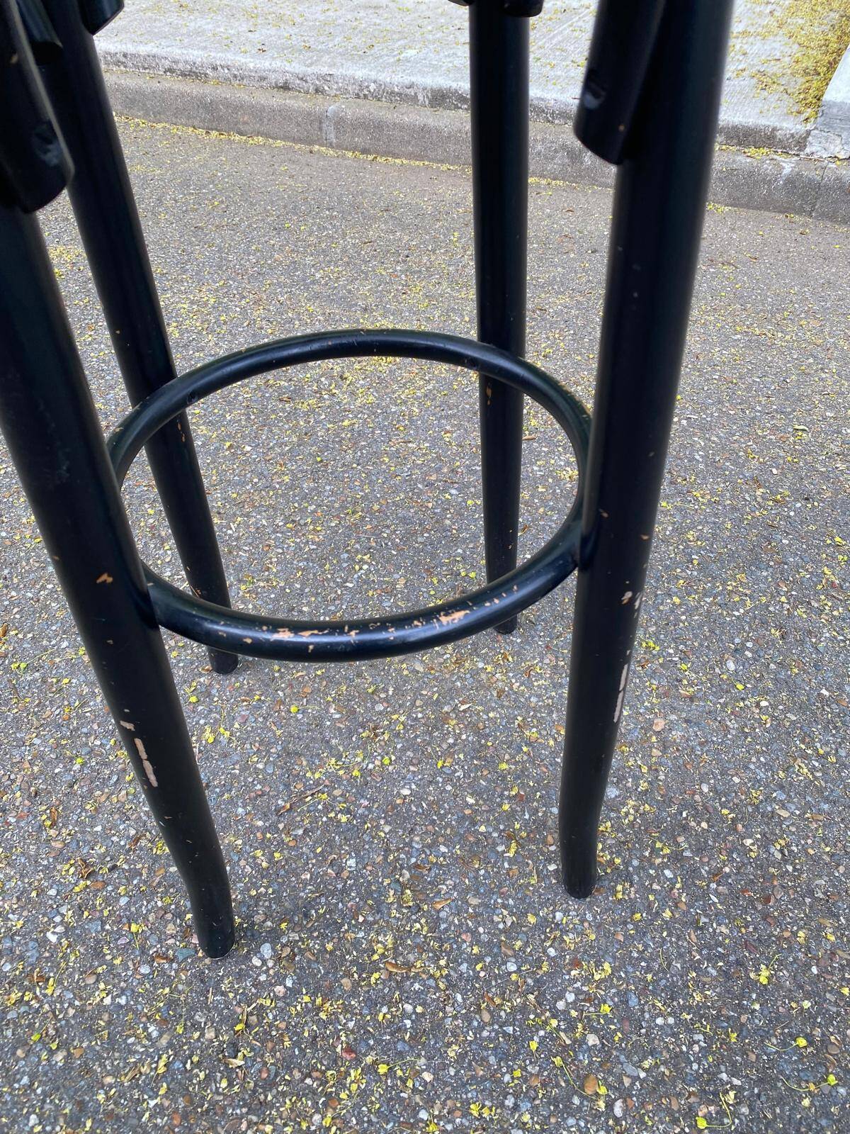 High curved black caned wooden bistro bar stool