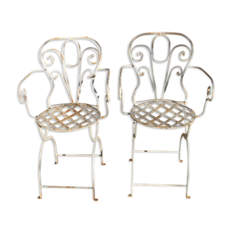 Pair of wrought iron armchairs