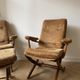 Pair of vintage 70s armchairs in brown and orange velvet with footrest.