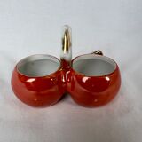 Porcelain salt shaker and orange pepper shaker decorated with a cicada