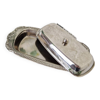 Old butter dish in chiseled silver metal