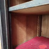 Bonnetière man standing cabinet a door