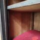 Bonnetière man standing cabinet a door