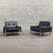 Pair of black leather armchairs