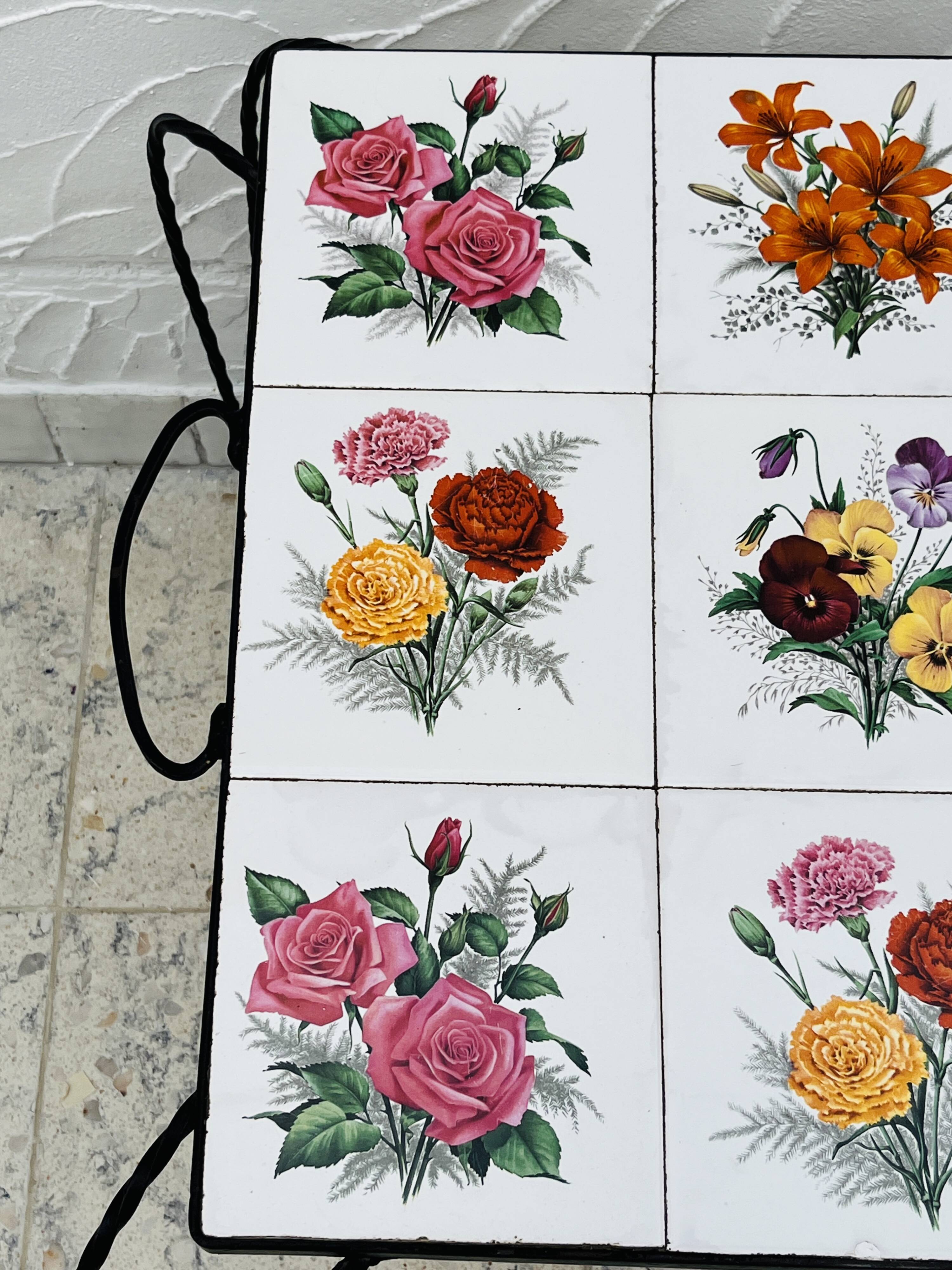 Vintage coffee table in wrought iron with floral tiles.