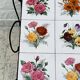 Vintage coffee table in wrought iron with floral tiles.