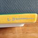 Yellow glazed ceramic trivet signed l. drimmer