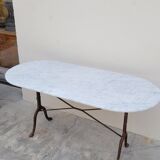 Restaurant bistro table in oval marble and decorated cast iron bases -1m51