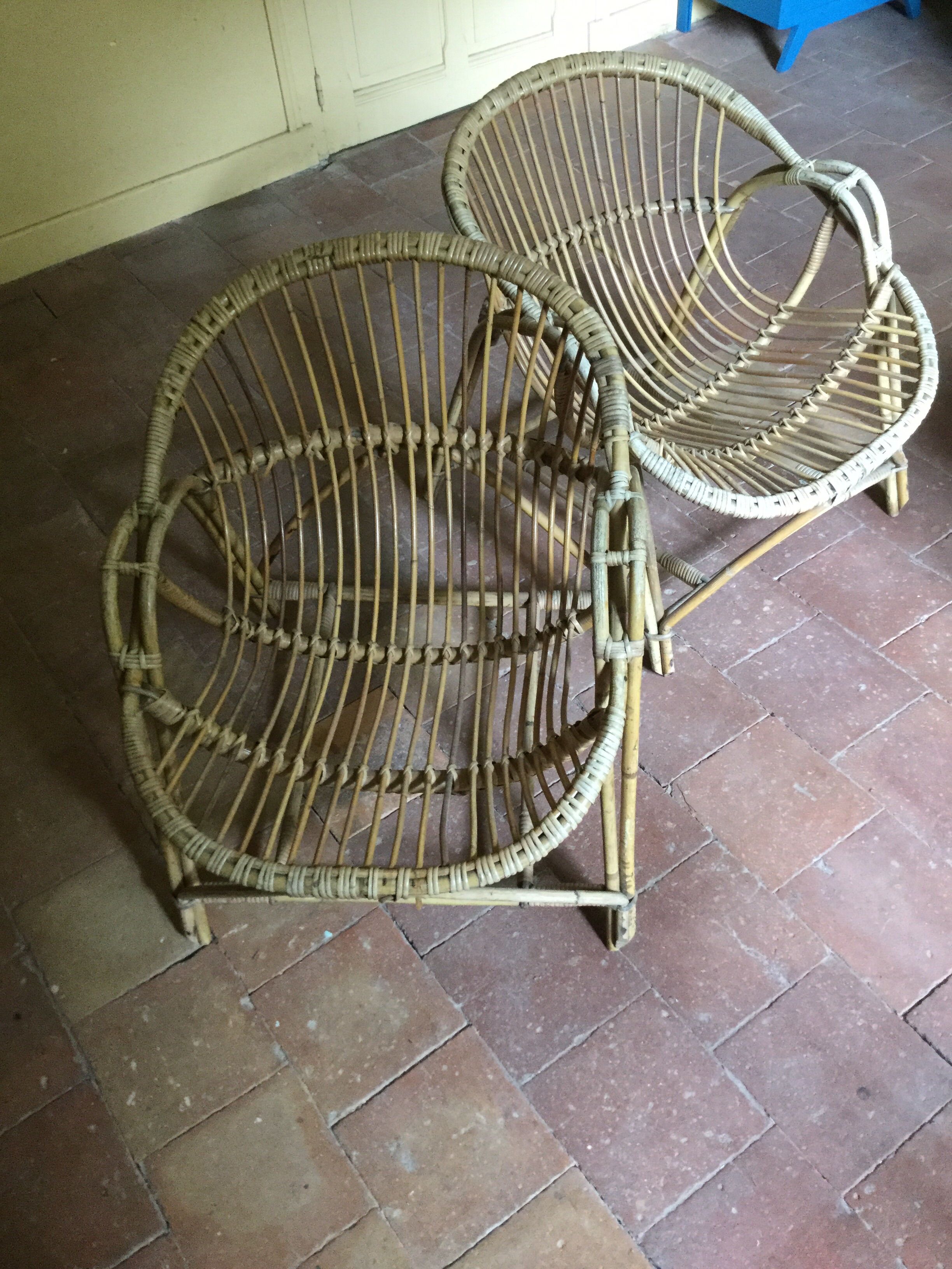 A pair of rattan armchairs