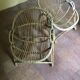 A pair of rattan armchairs