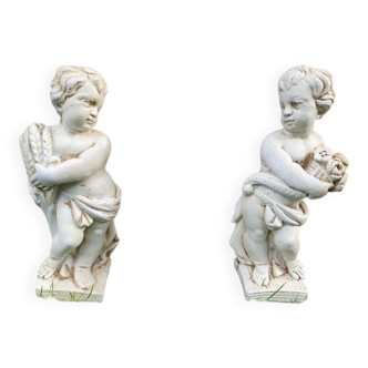 Pair of 19th century stone cherub statues.