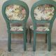 Antique chairs with studded upholstery.