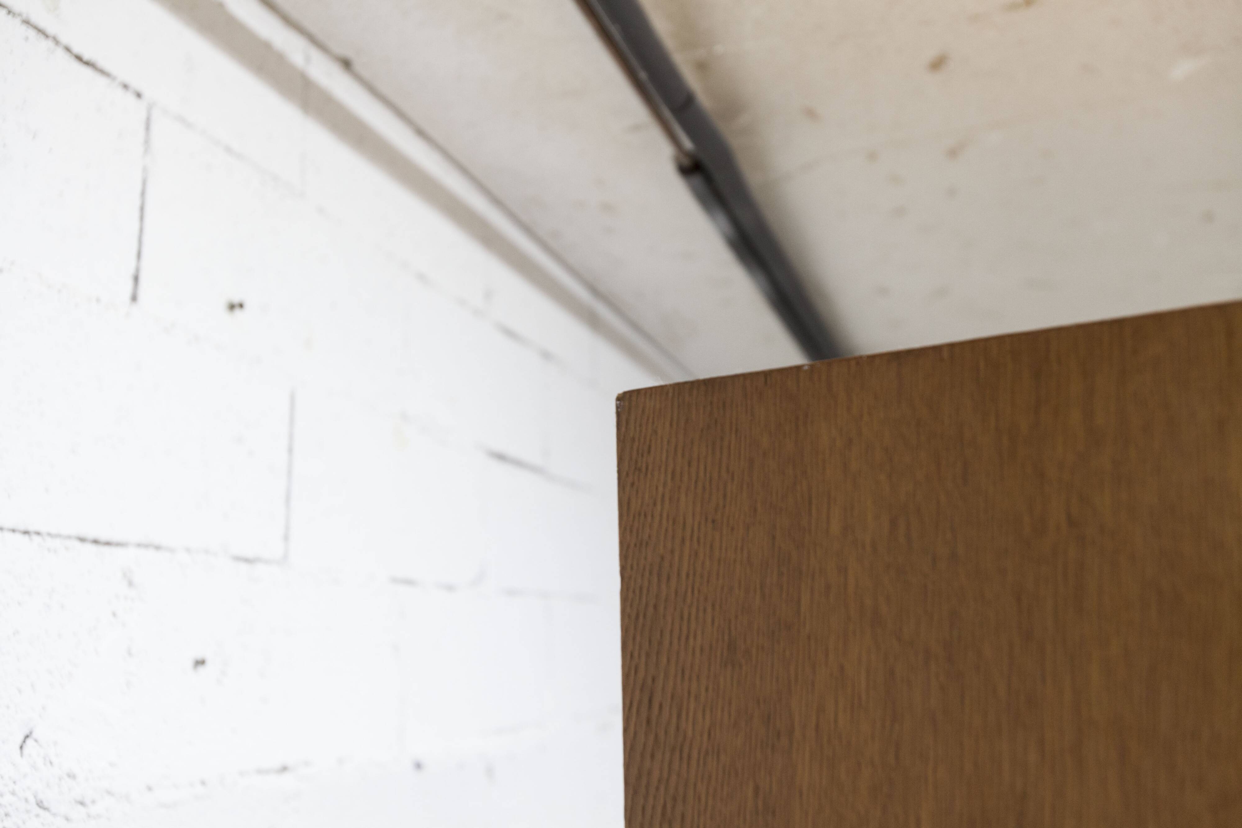 1950s Mid-Century Modern oak armoire with two doors and two drawers.