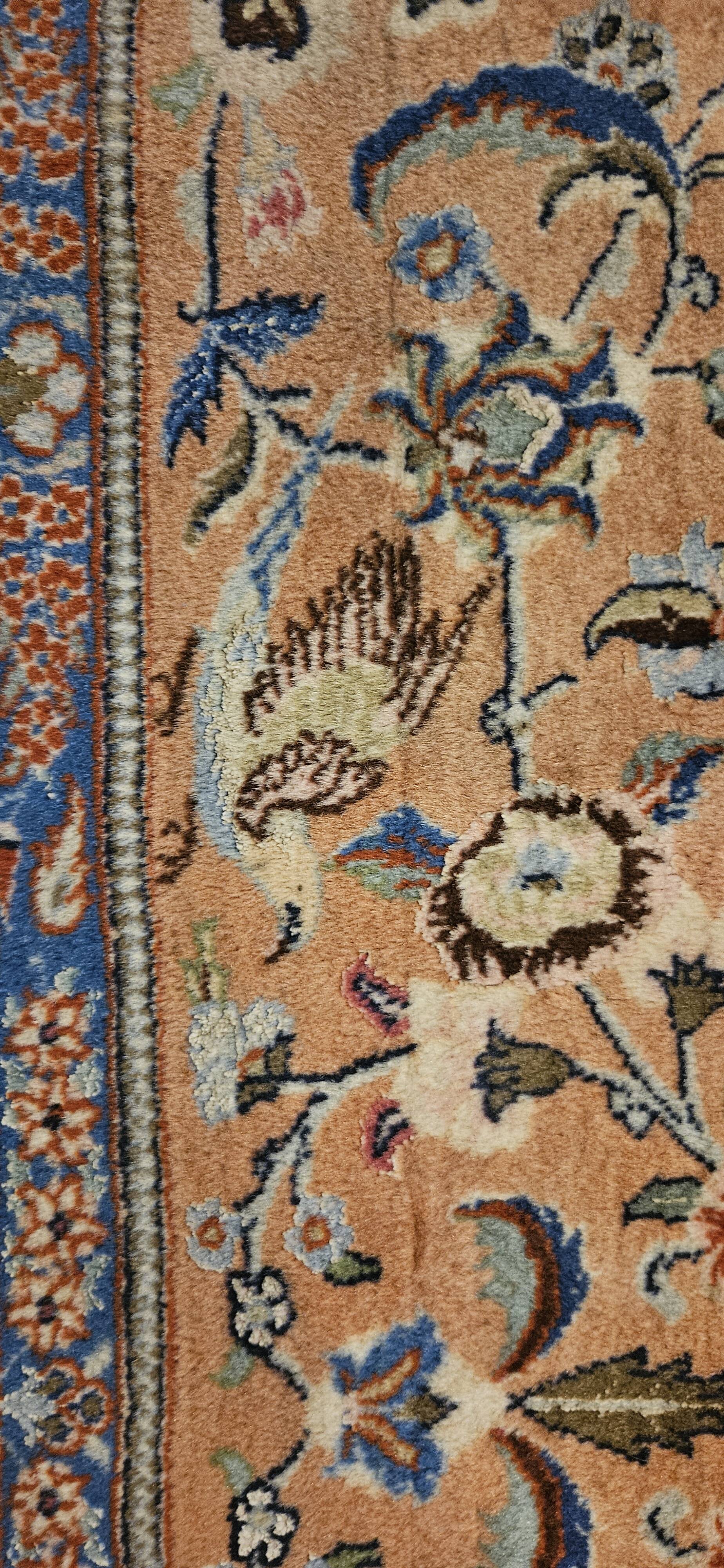 Large wool and silk oriental carpet.