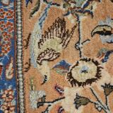 Large wool and silk oriental carpet.