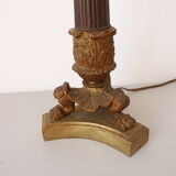 Empire period torch candle holder in bronze tripod base with lion's claws
