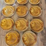 Vintage barbotine plates with fish decoration, 22 pieces.