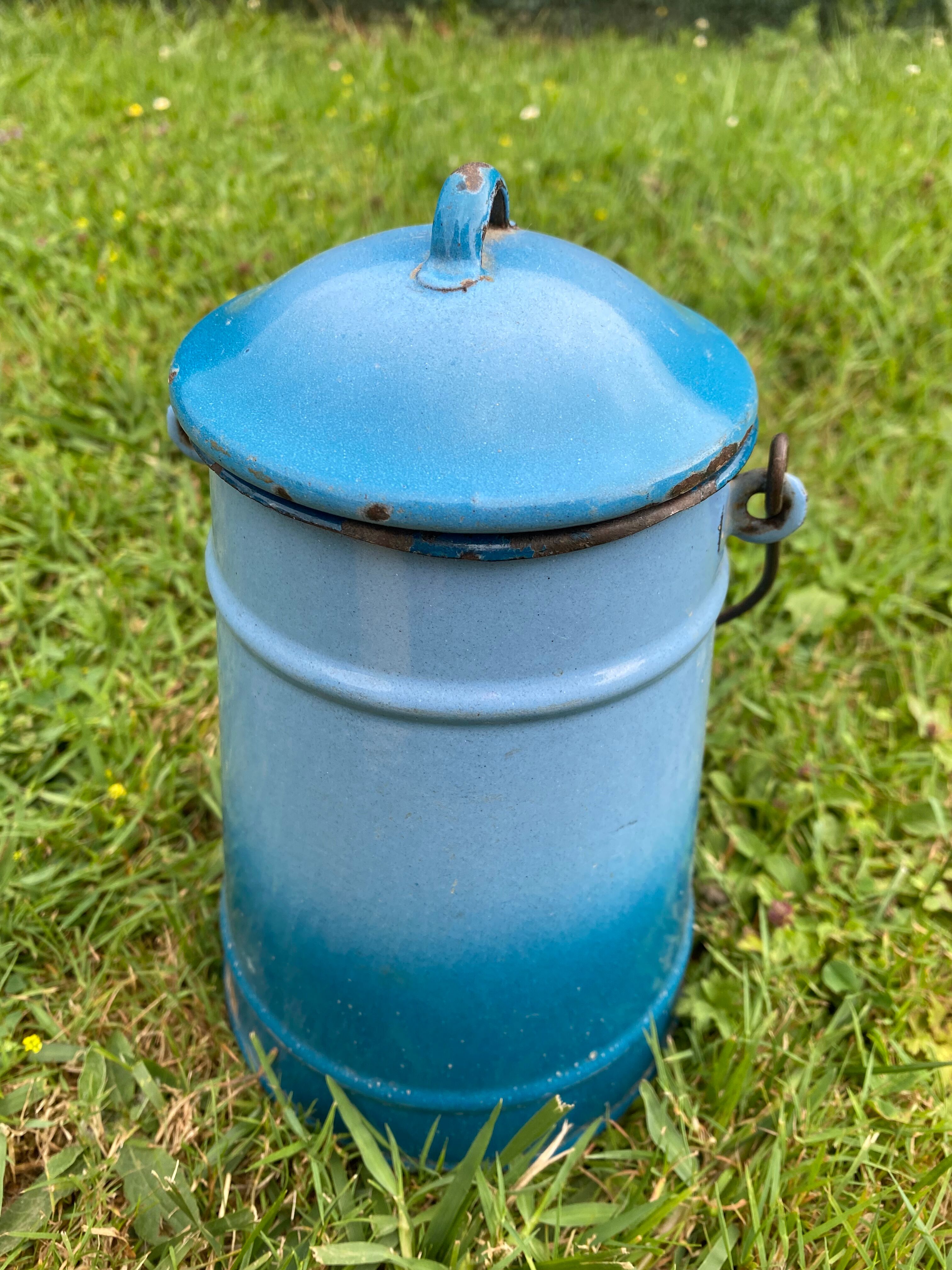 Old milk pot in enamelled sheet metal