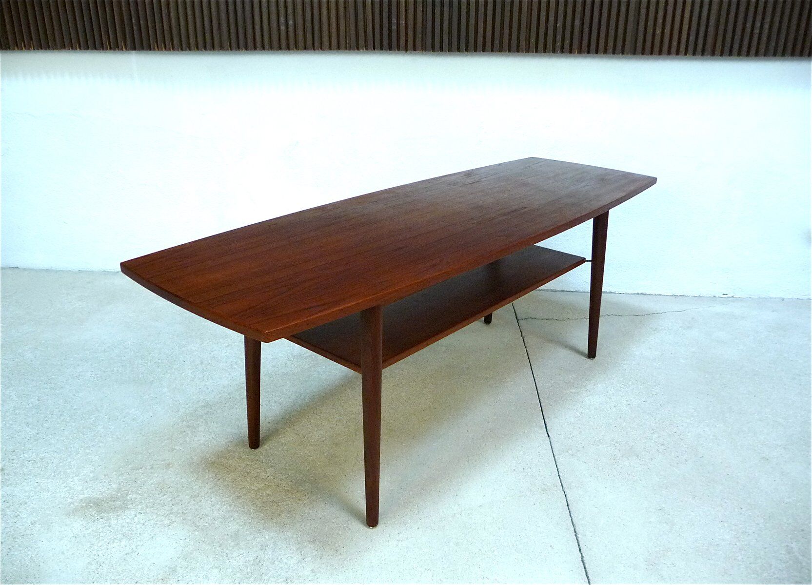 Curved Danish teak coffee table with additional shelf compartment, 1960s