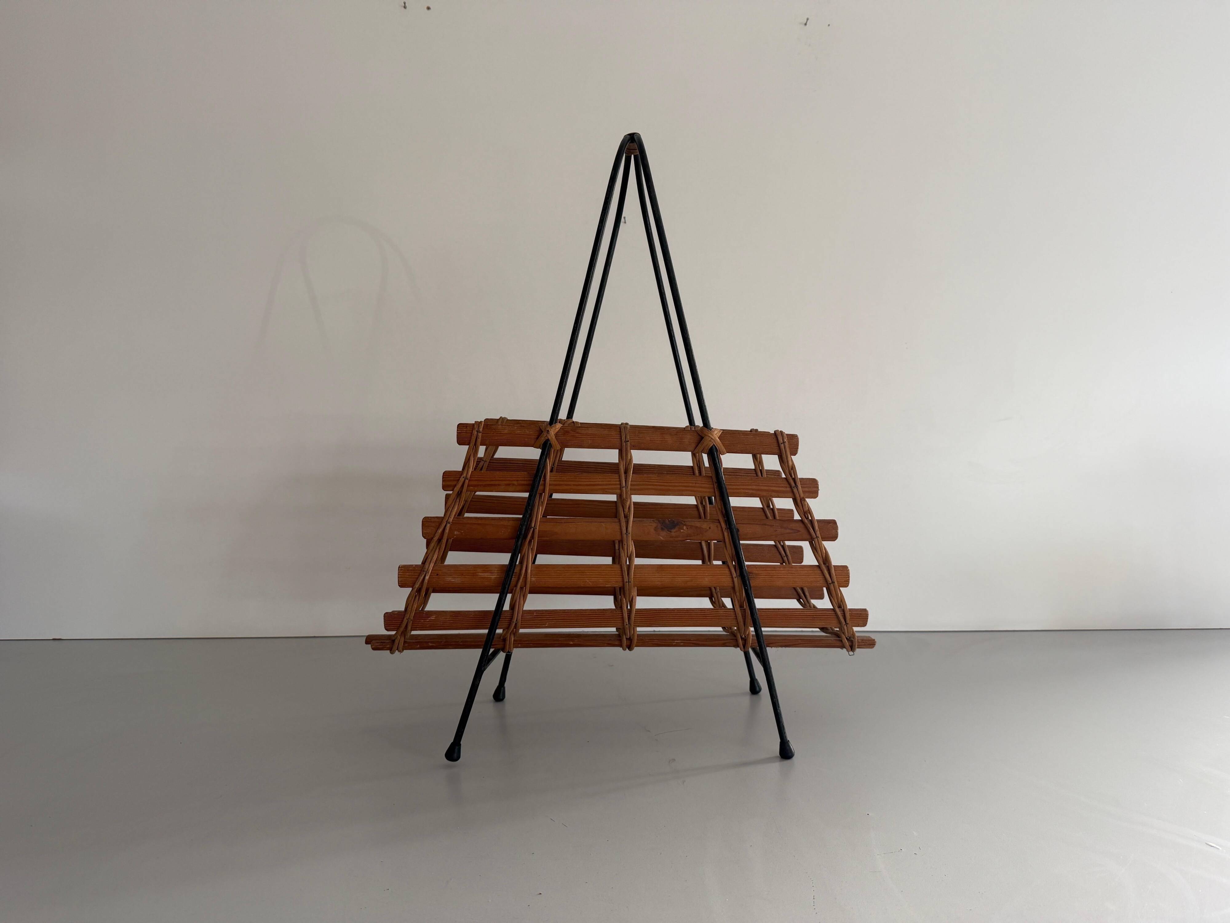 Mid-century black metal and wicker magazine rack, 1960, Germany