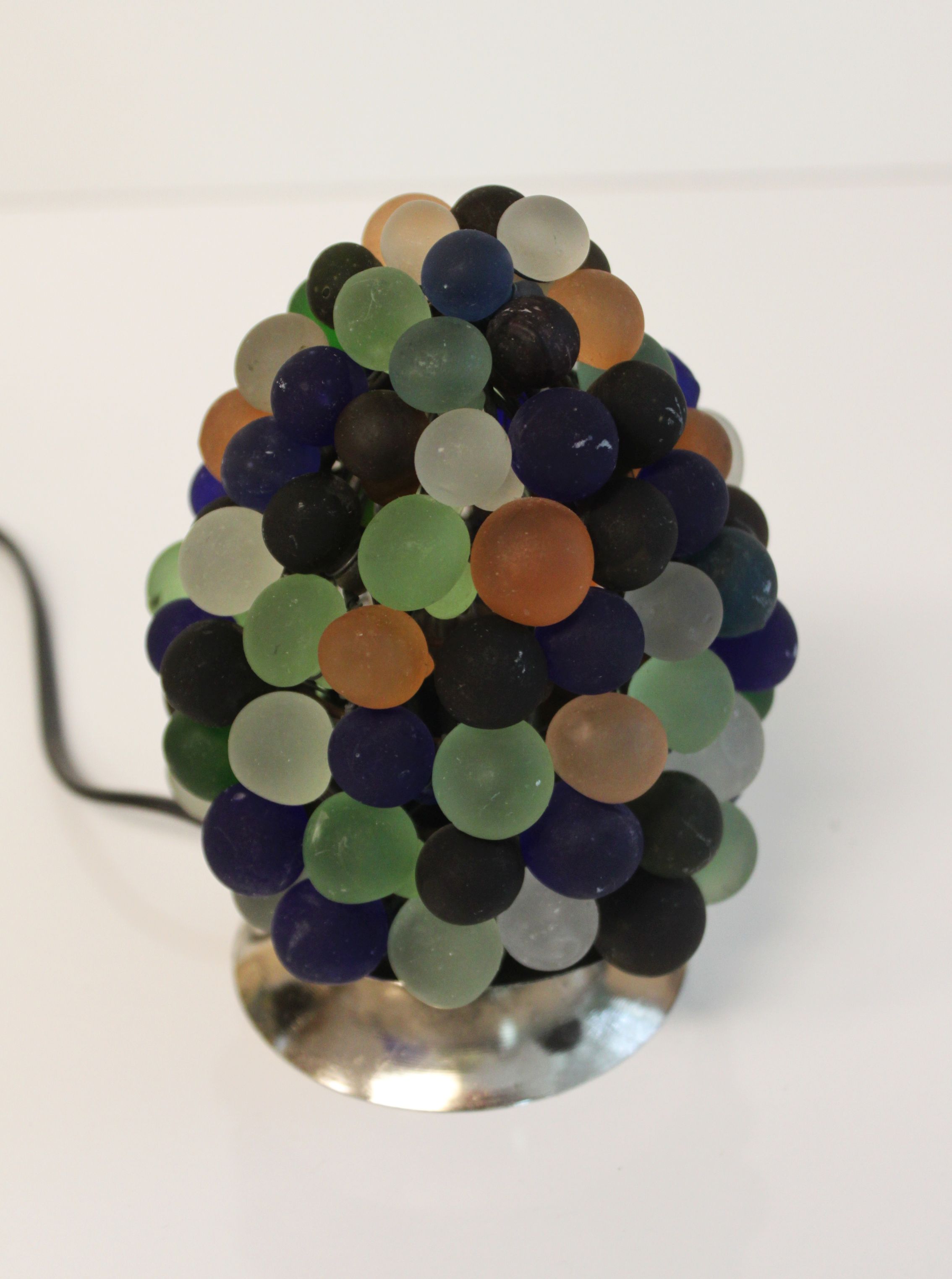 Night light in bunch of grapes, Italy.