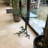 Wrought iron table with tree sculpture and glass top